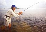 Angler works his soft plastic lure over the flats.