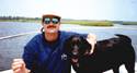 Capt. Steve Holmes with his dog Lou.