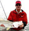 Capt_Alan_Sherman_of_Get_Em_Sportfishing_Charters_and_a_Fl_Bay_Snook_caught_on_a_Rapala_Flat_Rap_2.j