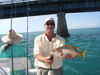 Capt_Alan_and_a_3_pound_dog_snapper.jpg