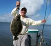 Captain_Tom_with_a_9_pound_southern_flounder.jpg