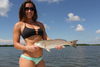 Jacki_with_an_Estero_Bay_Redfish_Photo_Alex_Dolinski.JPG