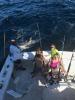 Mindy_and_kids_with_a_monster_lemon_shark_caught_with_New_Lattitude_Sportfishing.jpeg