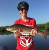 Youngster_with_Redfish_Photo_Capt_Neil_Eisner1.jpg