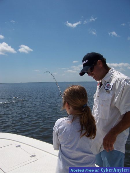 Bella hangs tough granddaughter of  Capt. Joe Porcelli as he gives a few ti