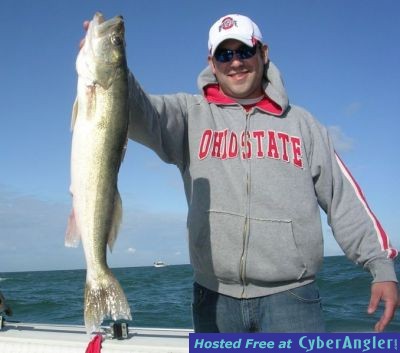 Matthew Diem of Findlay, Ohio proudly displays his Trophy Walleye caught ab