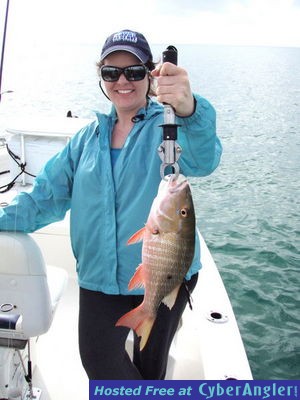 Dana_M_and_a_keeper_Mutton_Snapper_caught_in_the_finger_Channels_of_South_B