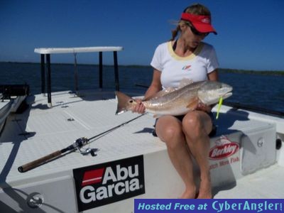 Kim caught this redfish on a Gulp Jerkshad with Capt. Joe Porcelli