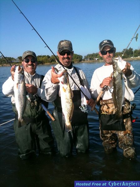 Three friends with big trout
