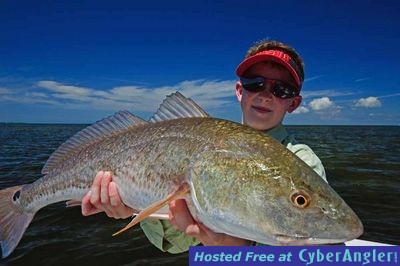 10 year old Aaron with a big redfish