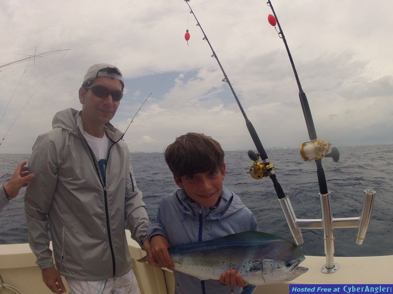 Posing with a dolphin