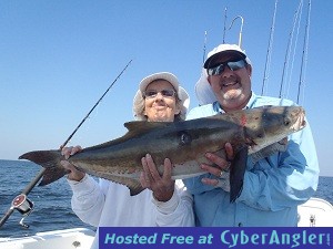 Momma_and_Rick_with_a_cobia-jpeg