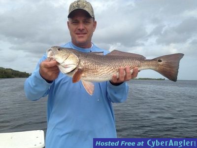 David Houck with one of many reds he caught with  Capt. Joe Porcelli,