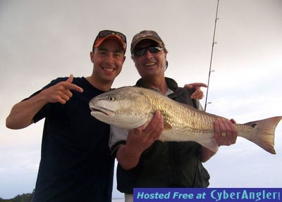 Son and Father celebrate redfish catch