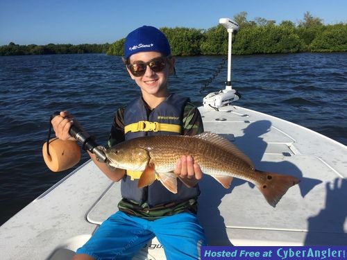 Younster_with_Redfish_Photo_Greg_Stamper