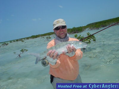 Capt. Rick Grassett with a Bahamian bonefish caught on a fly out of Andros