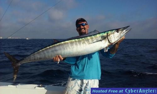Mick with a monster wahoo caught with New Lattitude Sportfishing