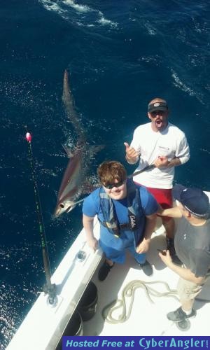 Josh with a huge thresher shark caught with New Lattitude Sportfishing