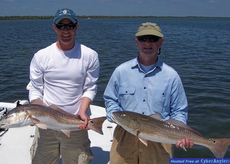 Tom and Fred Bergert with oversize reds
