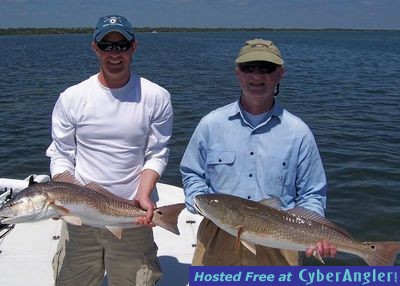 Tom and Fred Bergert with oversize reds