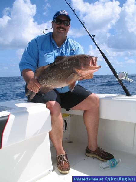 Hereâ€™s Rudy with a nice Red Grouper caught in 120â€™ of Key Biscayne, FL.