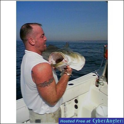 Sean with head shot of his 52 pound striper