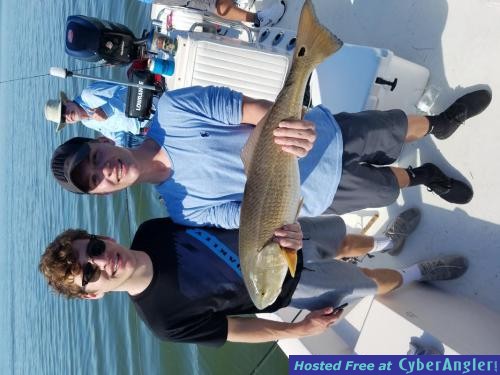 Mike_and_Johna_with_a_dock_cuahg_t_redfish_indian_rocks_beach_fishing_chart