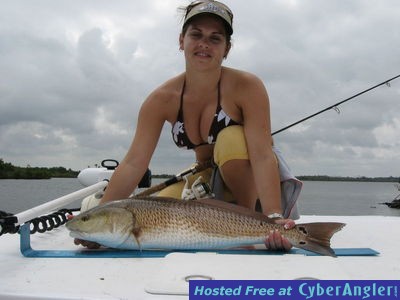 LIndsay Smith with her biggest red fish ever 36&quot; 14 lbs.