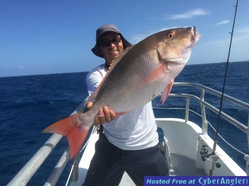 Orlando_with_a_monster_mutton_snapper_caught_aboard_the_Catch_My_Drift