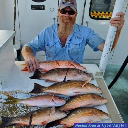 Johnny_with_a_nice_catch_of_snappers_aboard_the_Catch_My_Drift