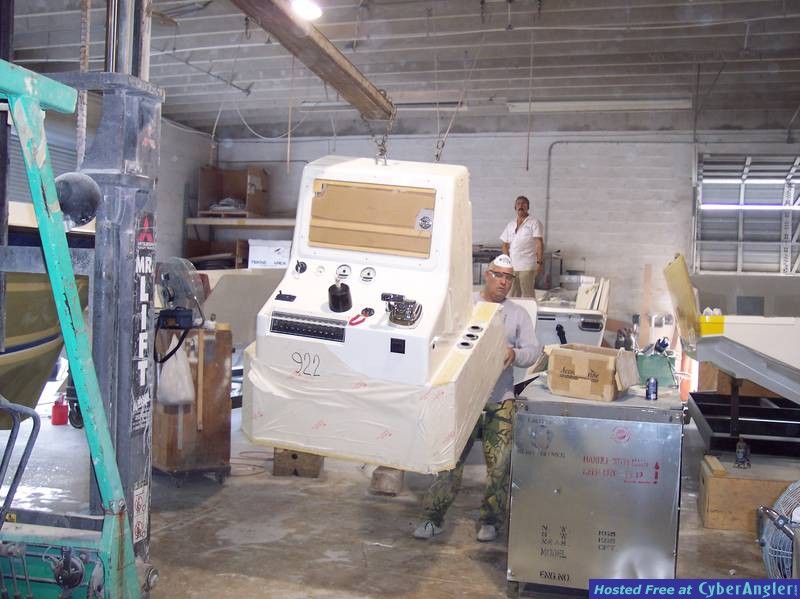 Console being lifted to be installed
