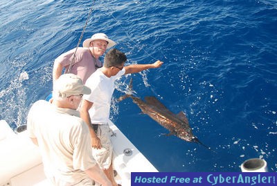 Joe Huckemeyer with sail fish