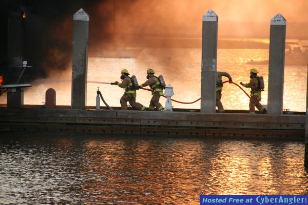 Firemen fight boat fire in Amelia Island